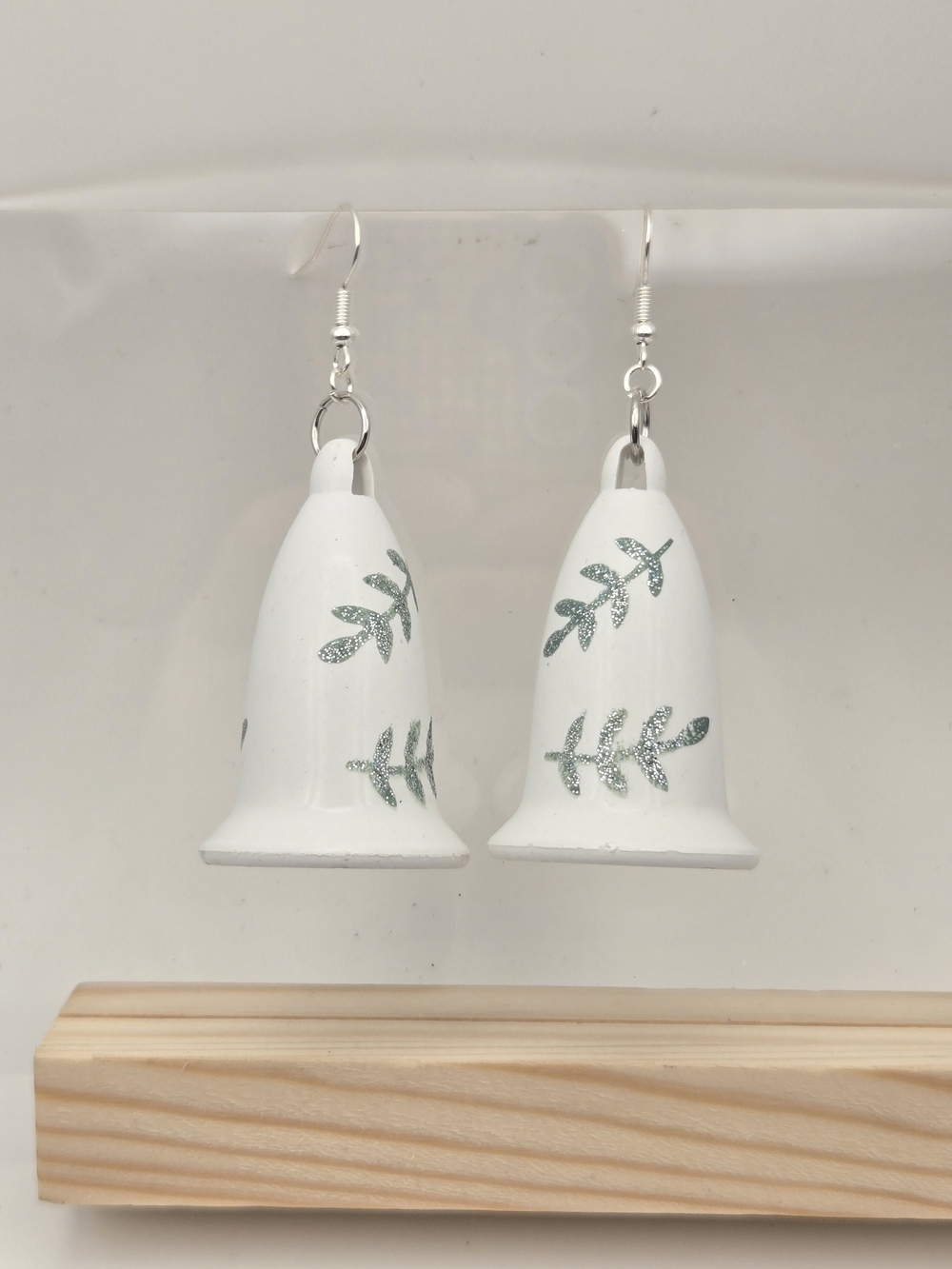 White Bell Dangle Earrings with Green Leaf Motif